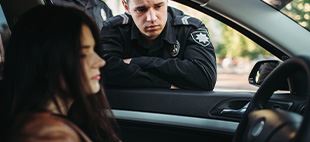 driver being pulled over by a police officer